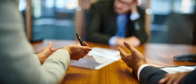 attorneys displaying professional conduct hands table